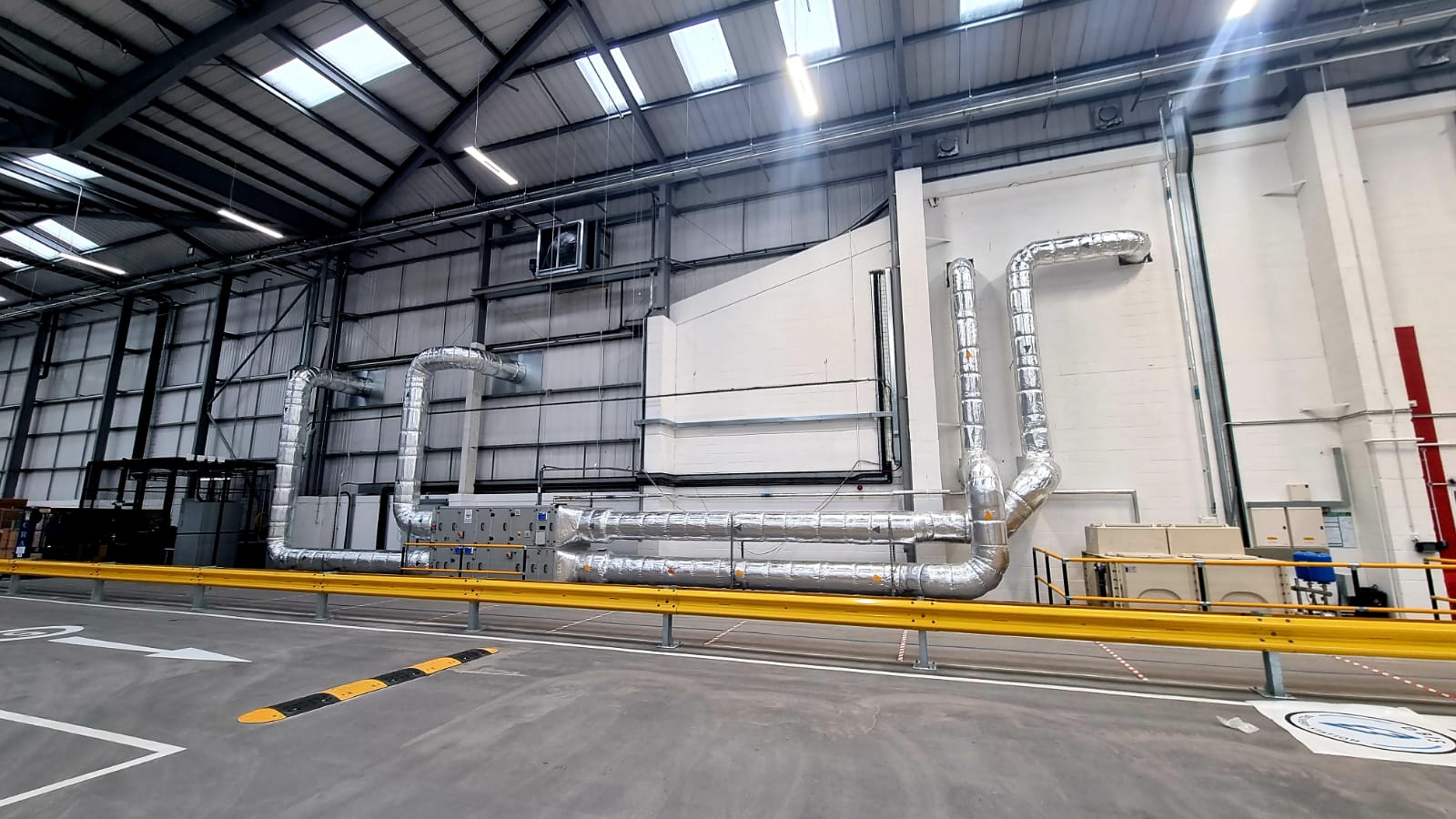 Commercial air conditioning condenser units installed on a UK commercial rooftop by Universal Cooling.
